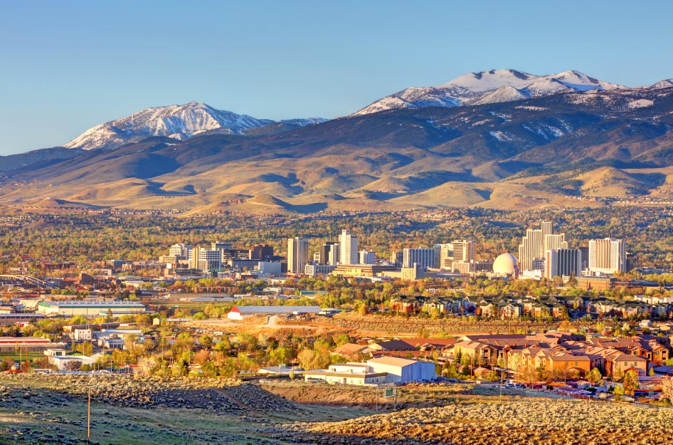 Sunny view of the Reno, Nevada, skyline with the mountains in the background.