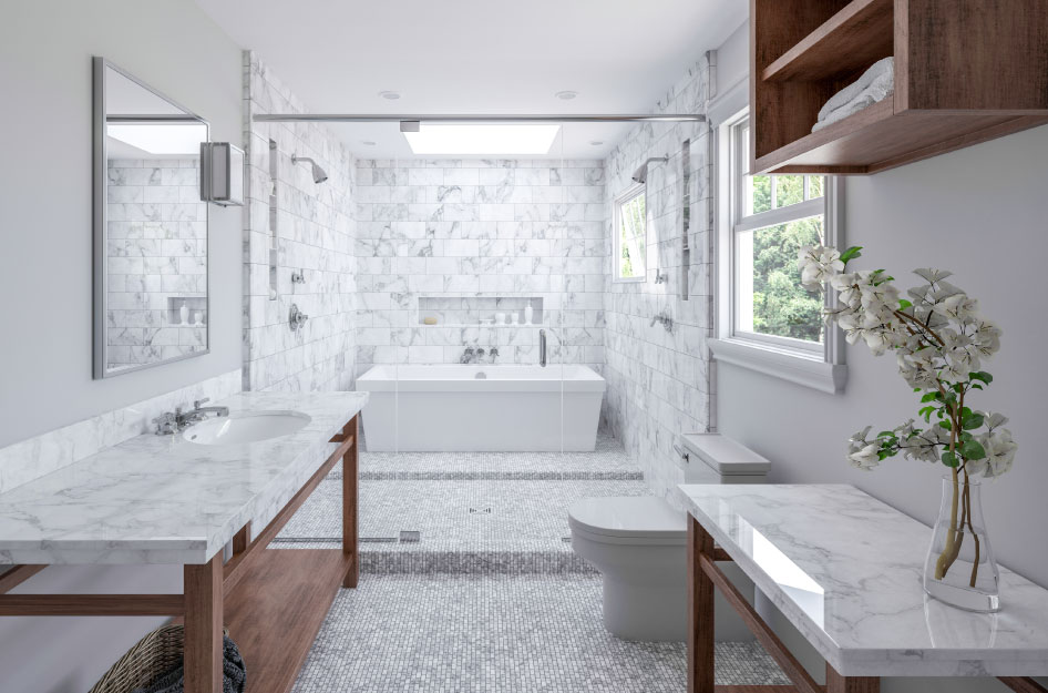 A newly remodeled primary bathroom featuring mini-tile flooring, marble counters and wall tiles, a tub/shower combo, and clean white walls.