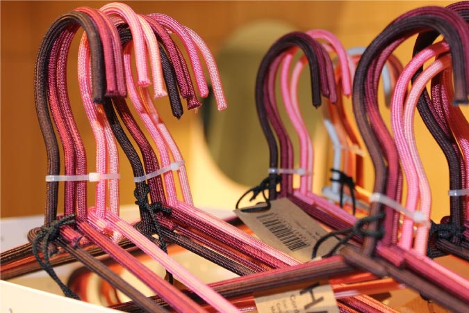 closet organization ideas include using color-coded hangers to organize your clothing