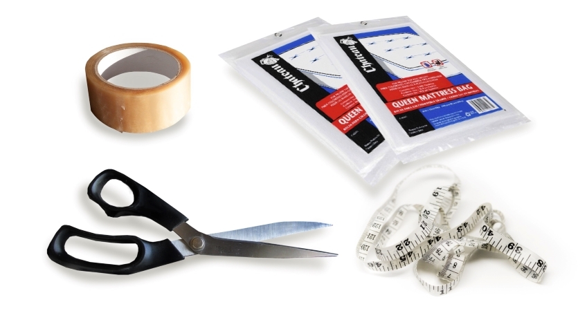 An image of various supplies used when moving a mattress, including mattress bags, a tape measure, packing tape, and scissors. 
