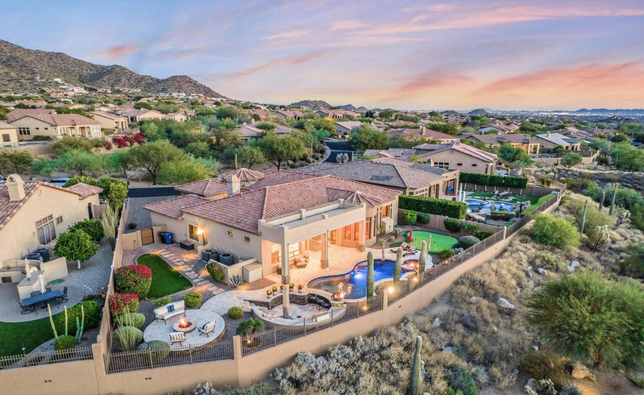 Aerial view of a luxury home in Mesa’s Las Sendas Golf Club, featuring a private pool and putting area.