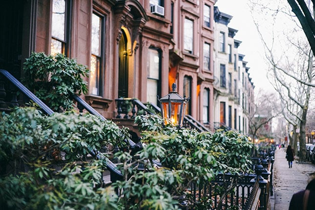 A close-angle view of a row of townhouses in the Park Slope neighborhood of Brooklyn, the most populous of the New York City boroughs.