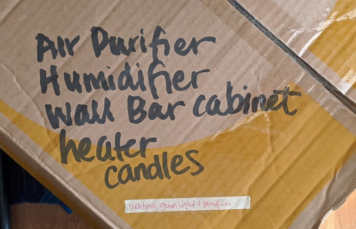 The top of a moving box with a detailed written description of the contents inside — another packing tip to help you keep track of your things while moving.