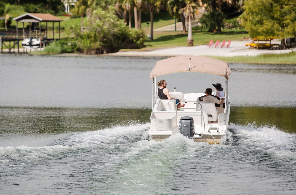 Locals enjoy a sunny day boating out on the lake near Leesburg, Florida.