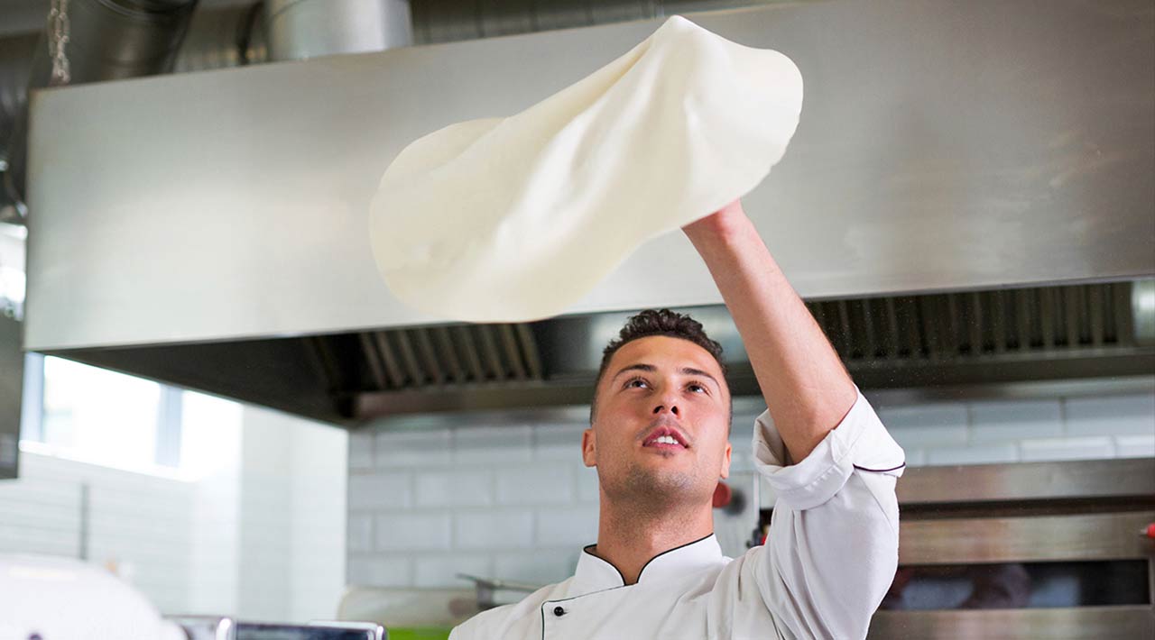 pizza chef tossing dough
