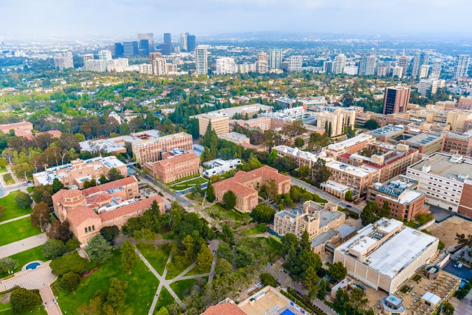 Aerial view of the UCLA University Campus in Westwood — among the priciest Los Angeles neighborhoods — with the rest of LA sprawling out in the background.