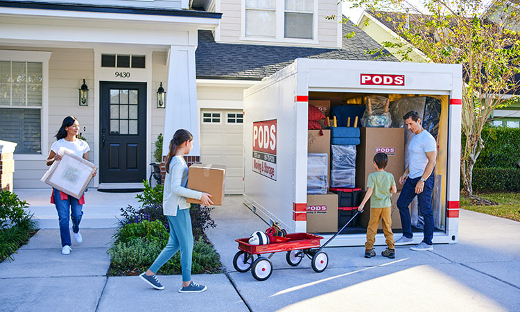 A family loading their PODS container for their Fort Lauderdale move.