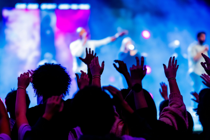 Concert-goers enjoy a show while living in Detroit.