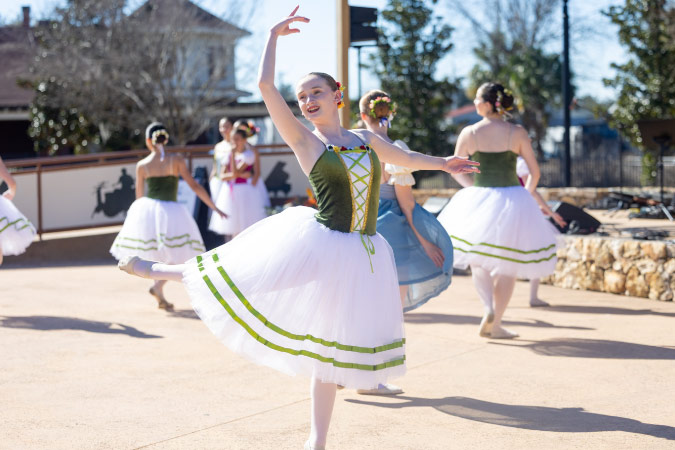 Young dancers perform in the sunshine during Sculpture Stroll, one of the many things to do in Ocala, FL.