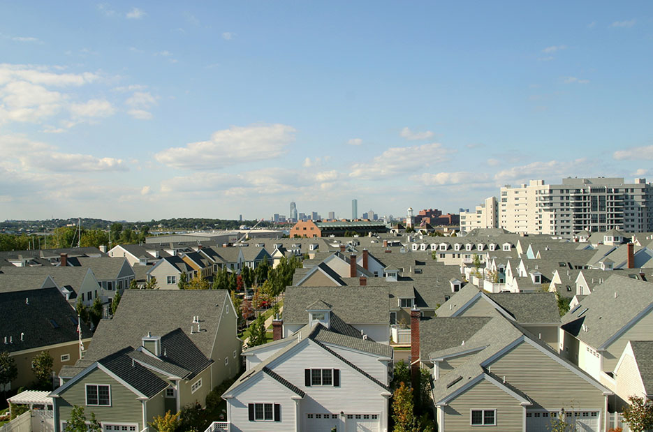 a view of rows of houses in a suburb of Boston