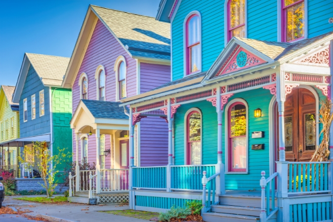 Colorful Victorian-style homes line a quiet street in Allentown, one of the most distinctive places to live in Buffalo, NY.