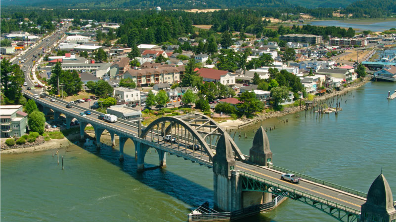 Aerial view of Florence, a small city on the banks of the Siuslaw River in Lane County, Oregon on a sunny day in summer.