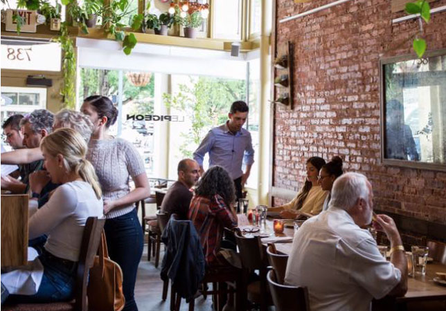 Le Pigeon, a French restaurant in Portland, Oregon, is full of patrons during the lunch rush on a sunny day in Portland.