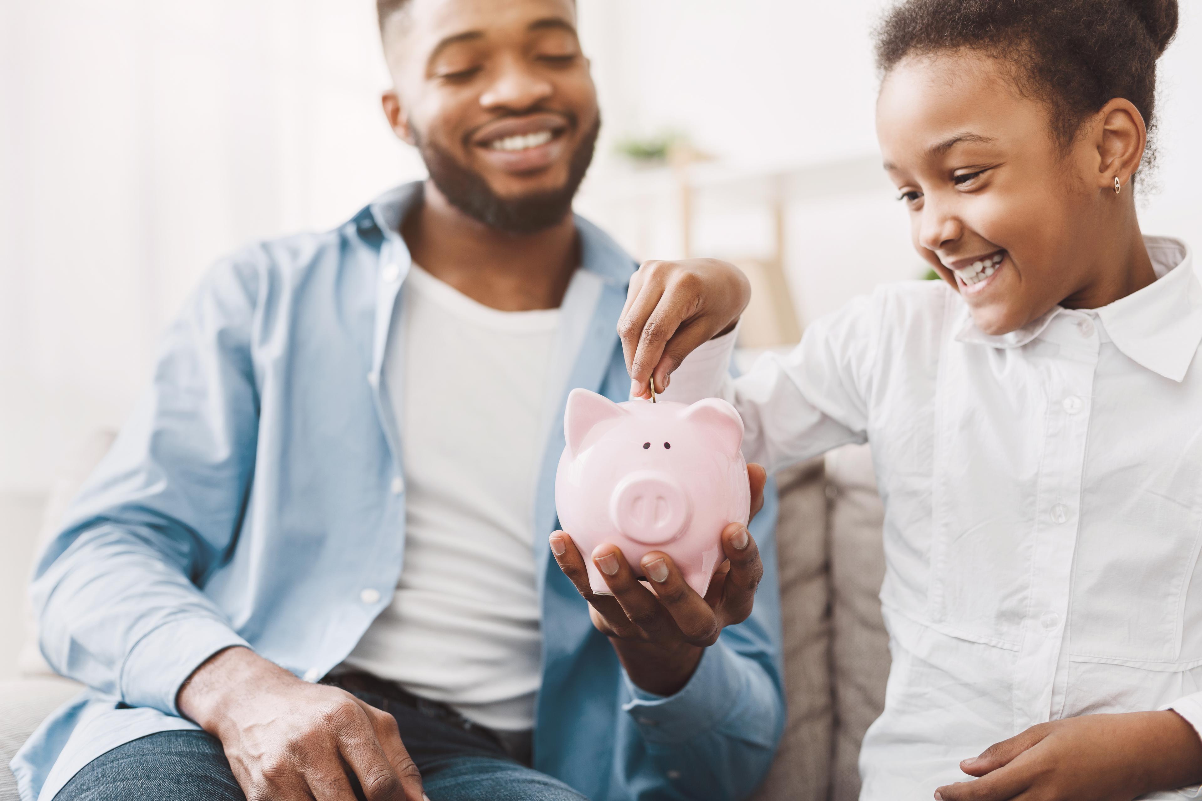 HRLIB-Father Daughter Piggybank-shutter_1302763831_HR.jpg
