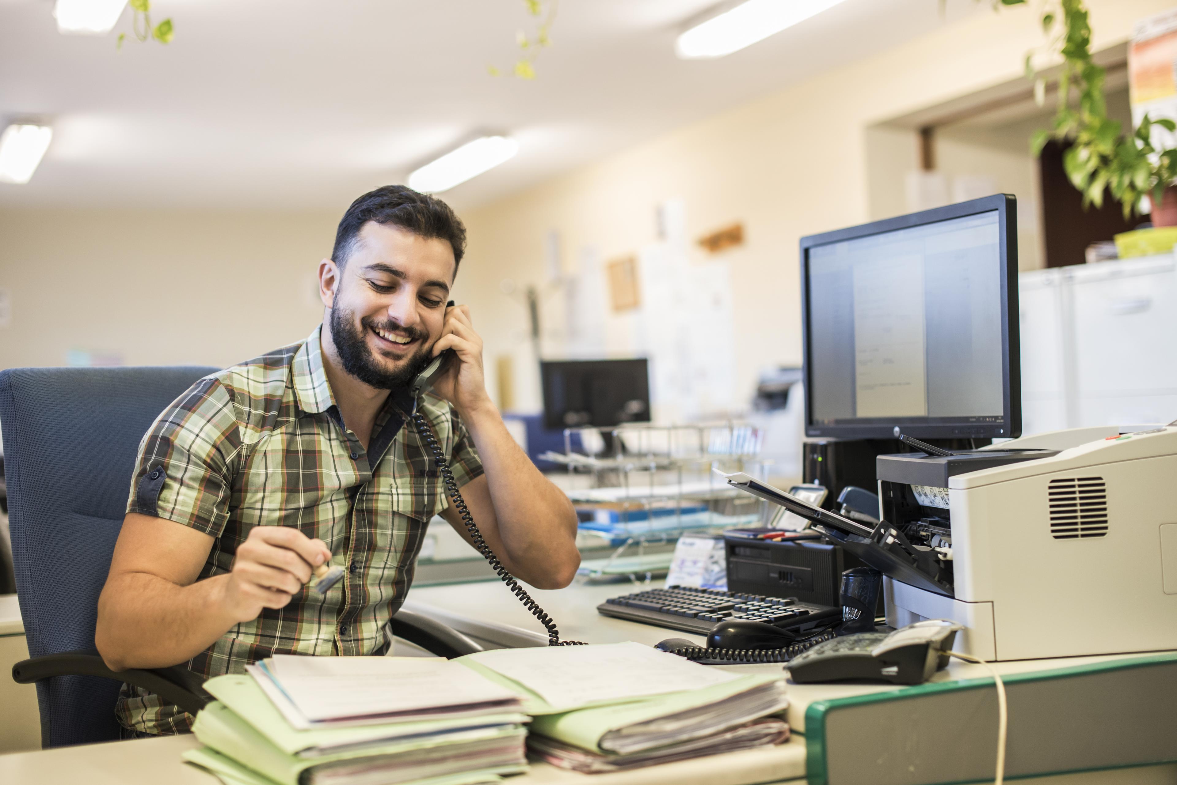 HRLIB-Latino man at desk-shutter_323676056_HR.jpg