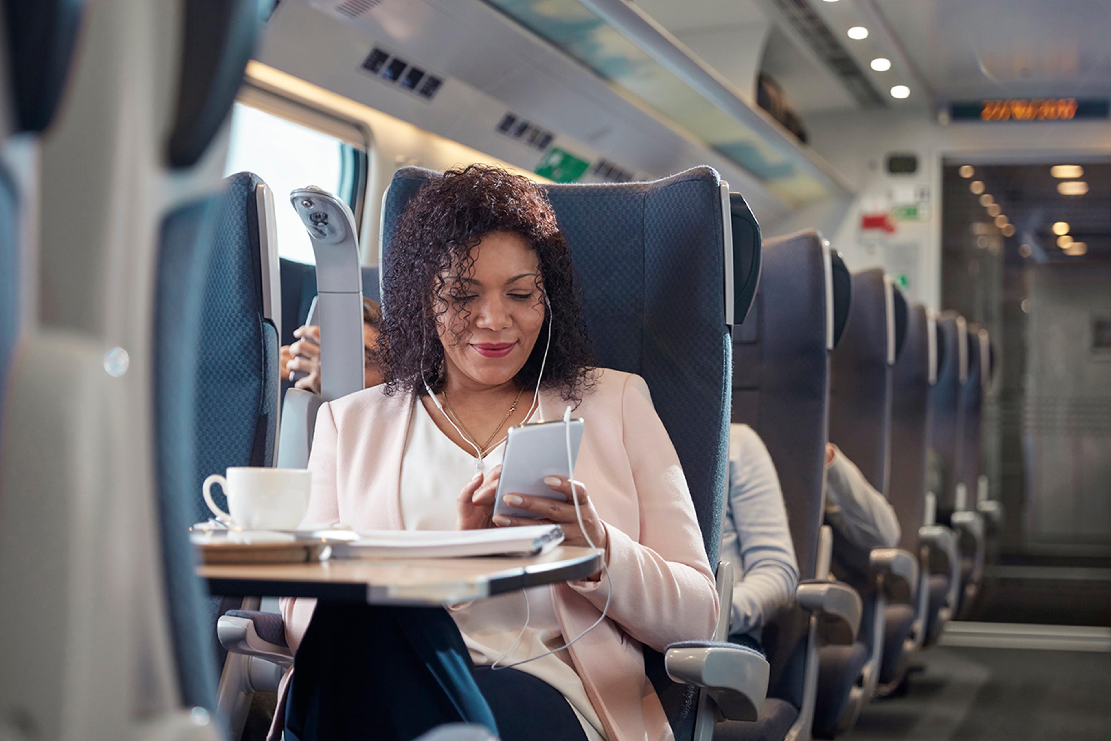 CL-MOBILE-woman-using-mobile-device-on-the-train-Getty-939658760-LR.jpg