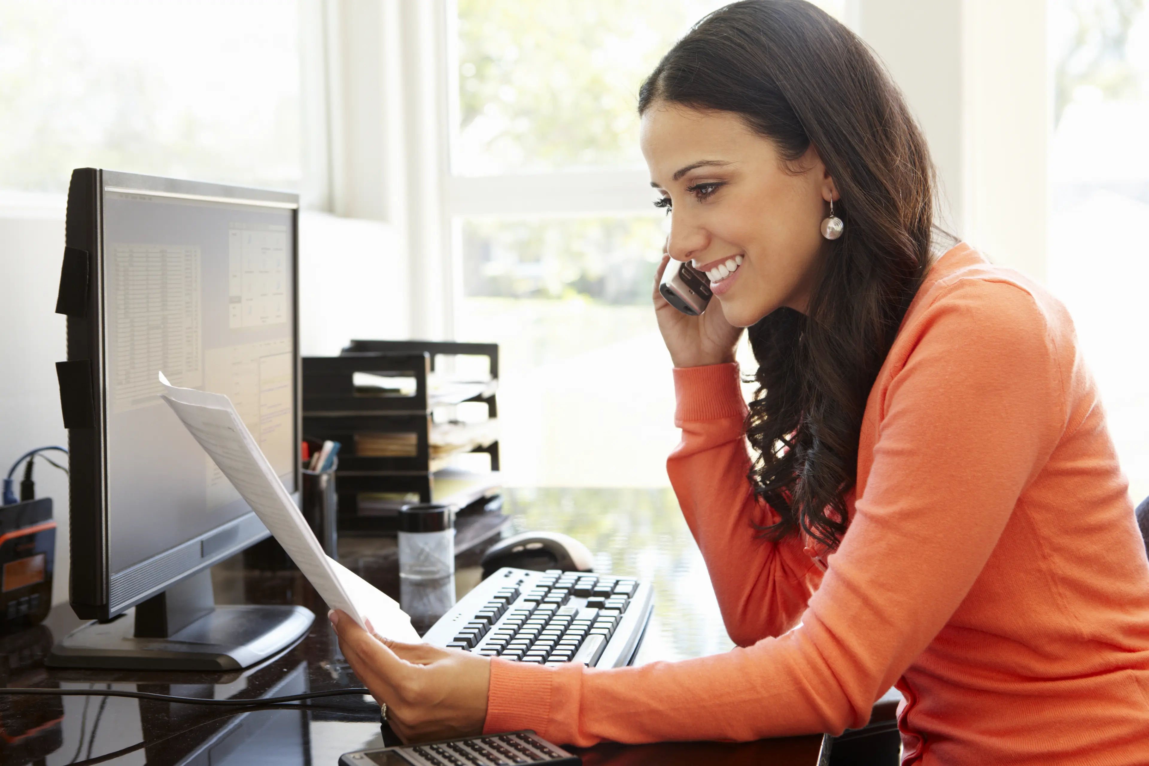 HRLIB-Latino woman on phone and computer-shutter_280357511_HR.jpg