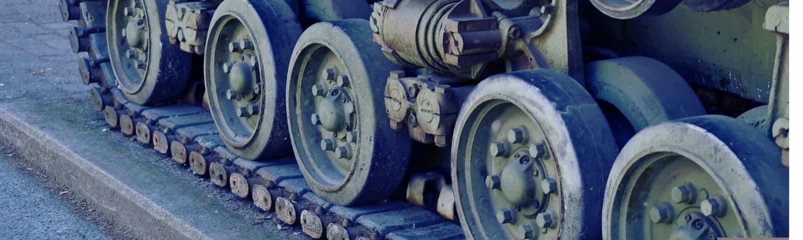 Close-up of a tank’s tracked wheels and treads