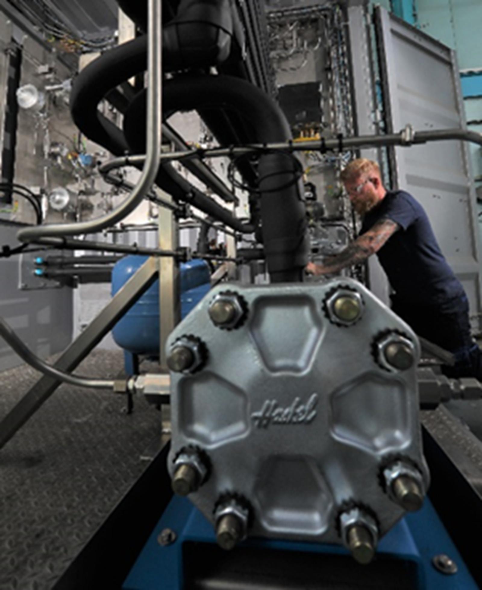 How do Haskel hydrogen compressors maintain gas purity