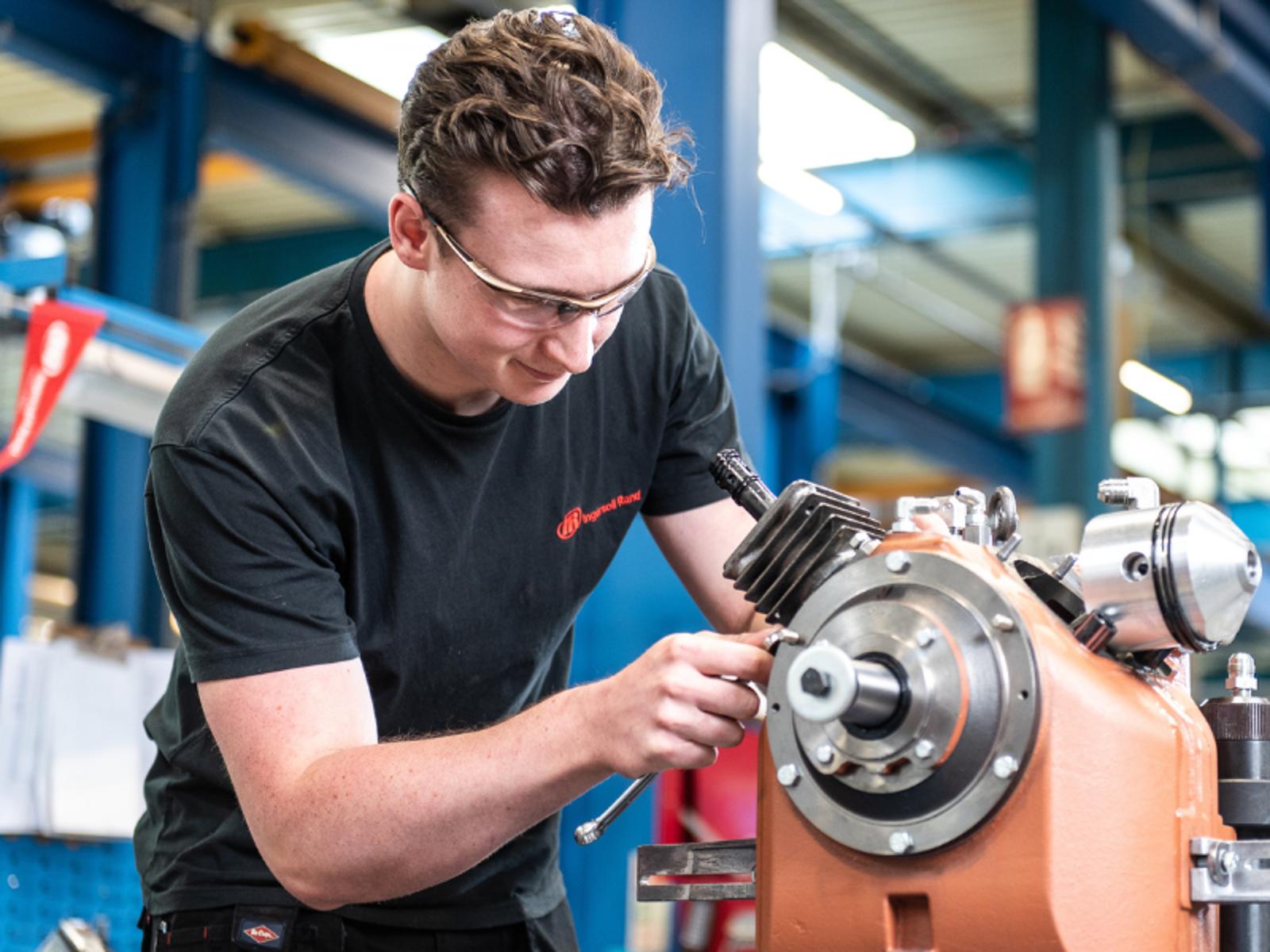 A person working on a machine