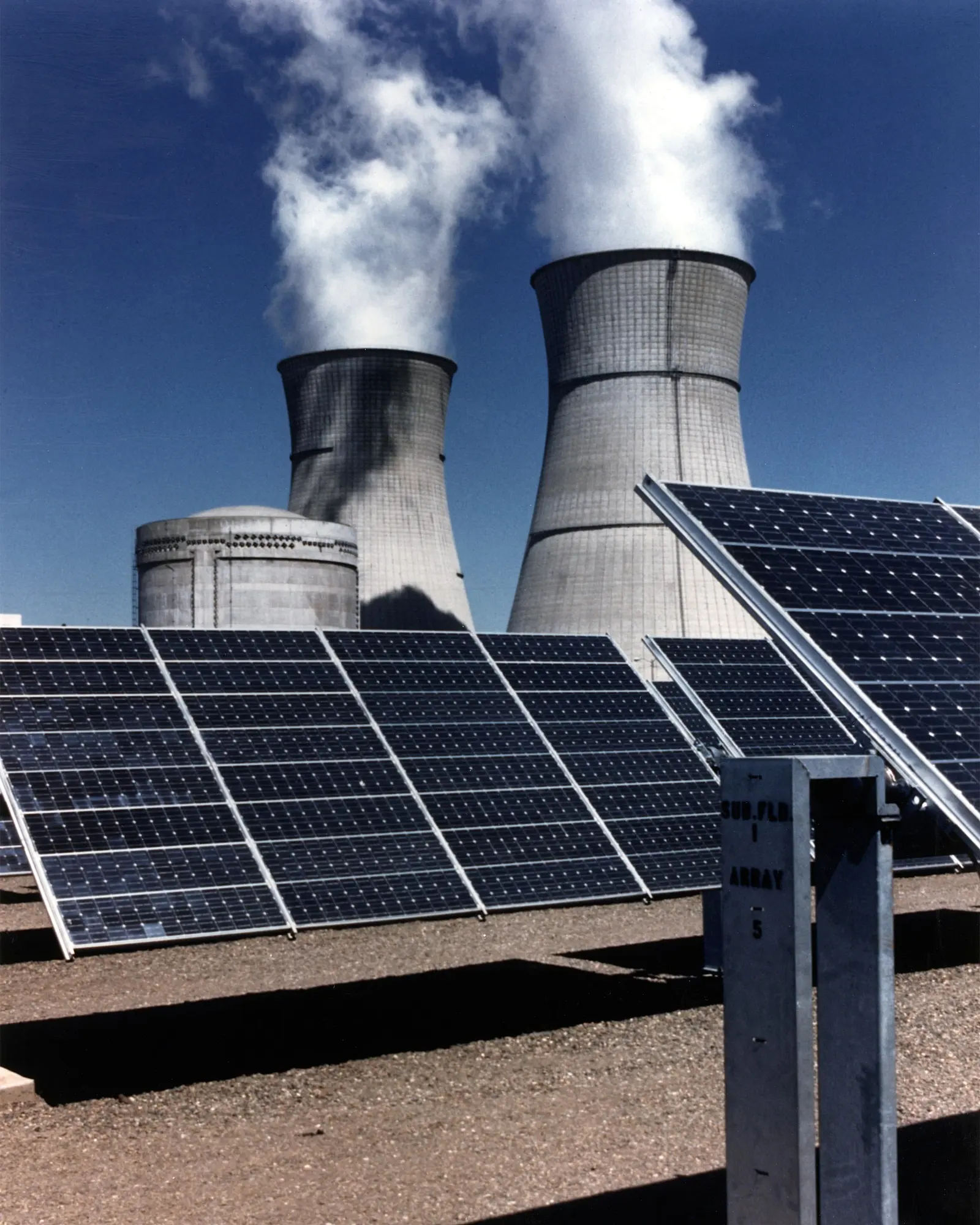 Solar panels next to nuclear cooling towers — renewables and nuclear in the energy transition