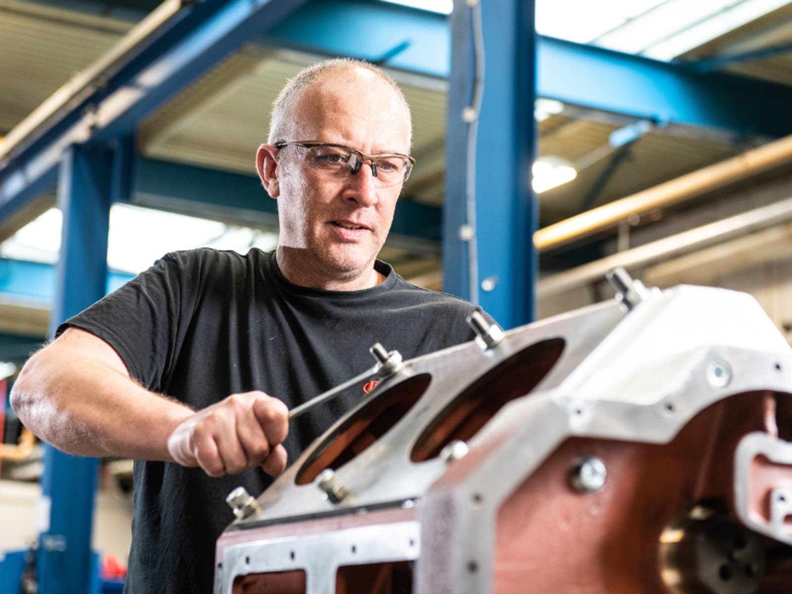 A person working on ingersoll rand air compressor systems machine