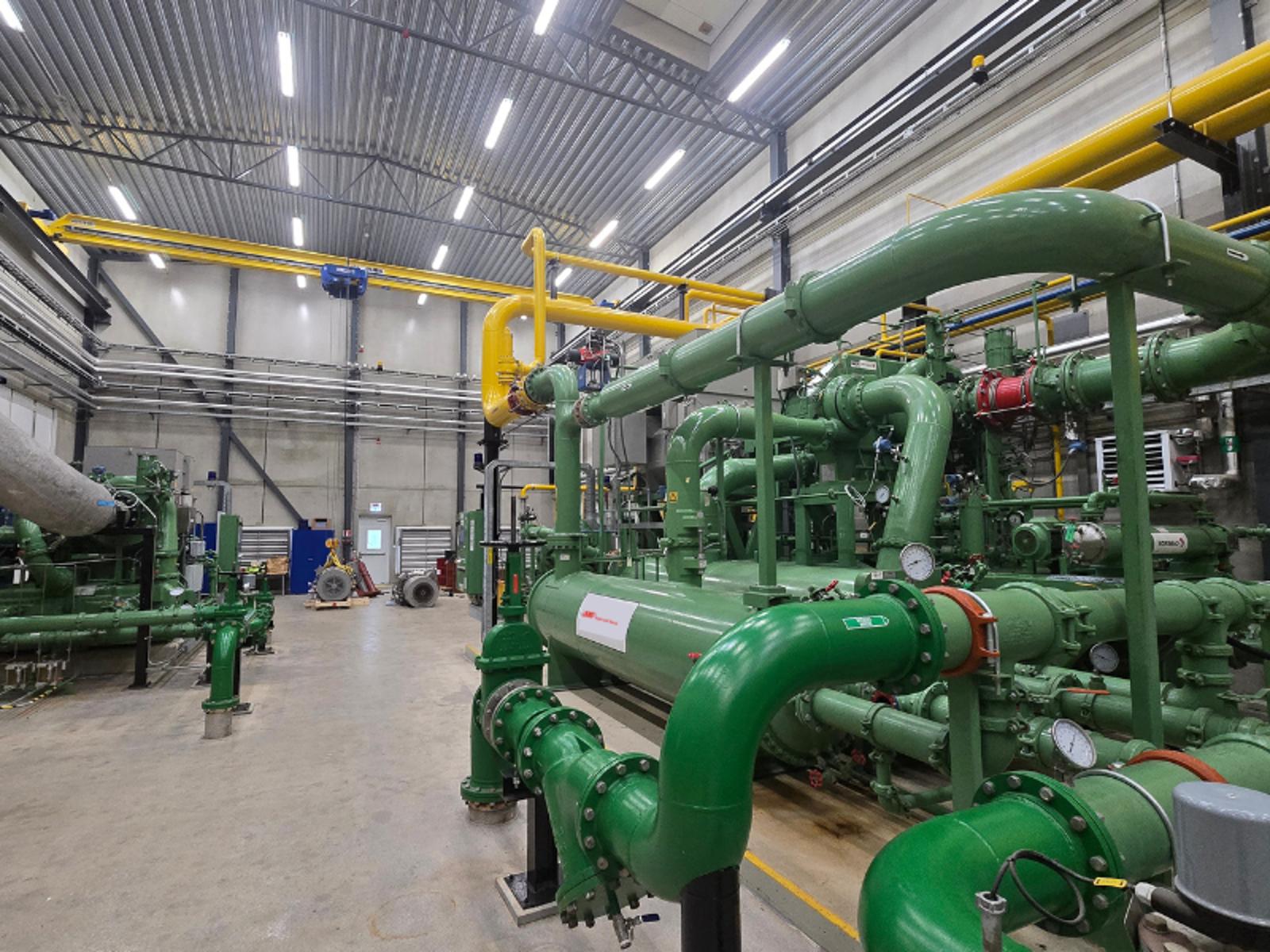 A centrifugal air compressor green pipes in a factory Ingersoll Rand