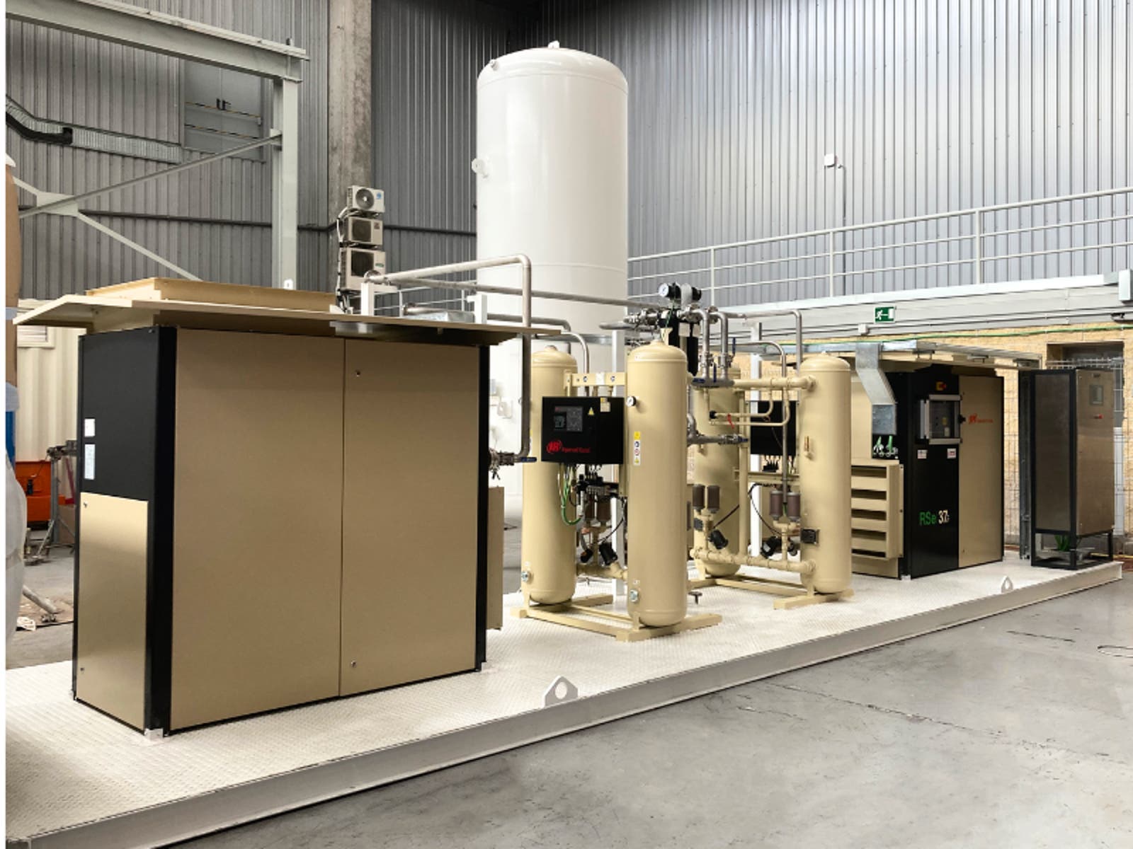 A large ingersoll rand air compressor machine in a factory