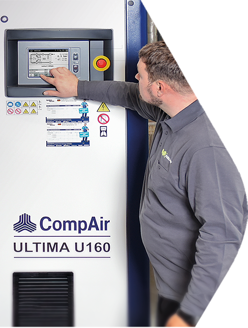 Industrial compressor technician adjusting control panel
