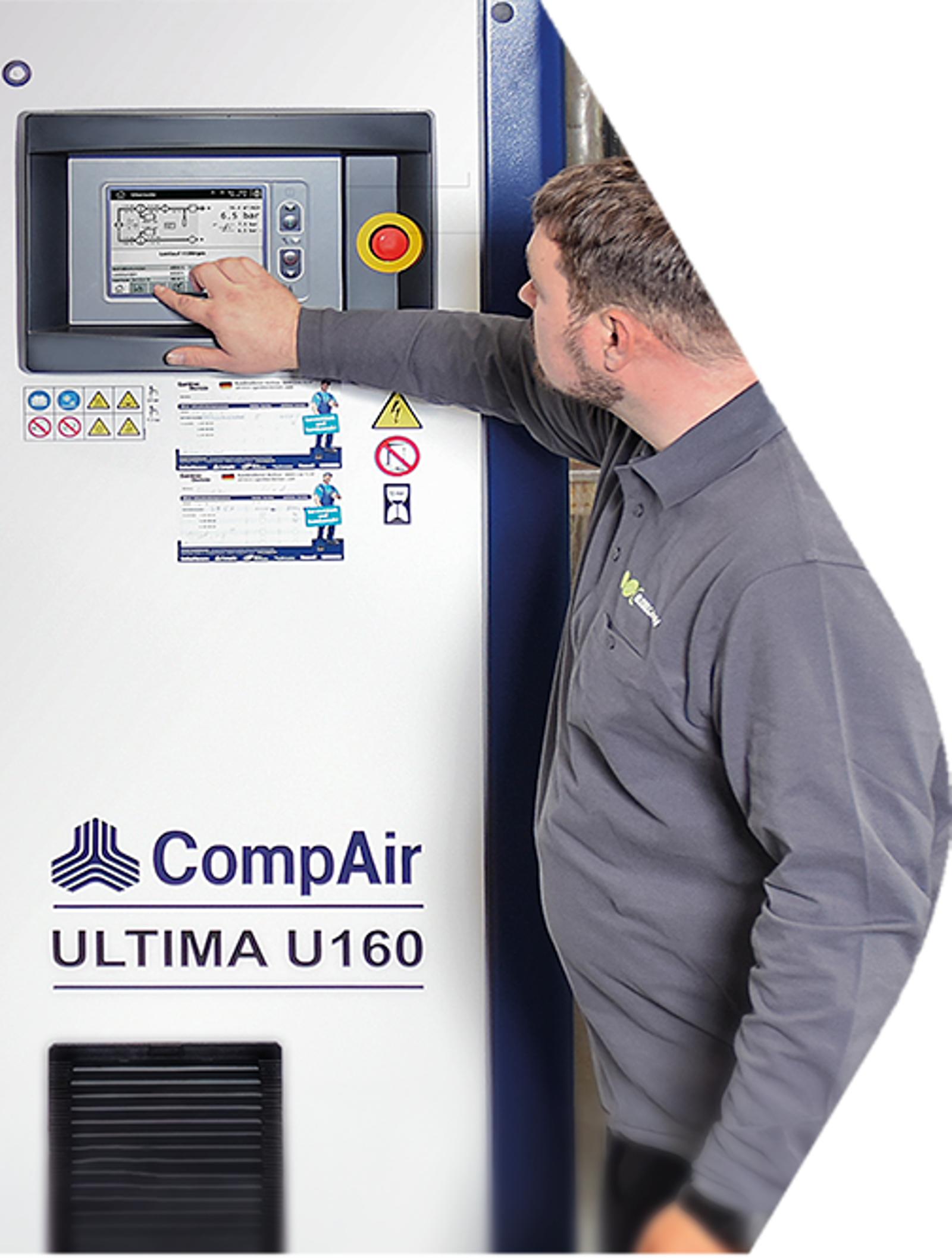 Industrial compressor technician adjusting control panel