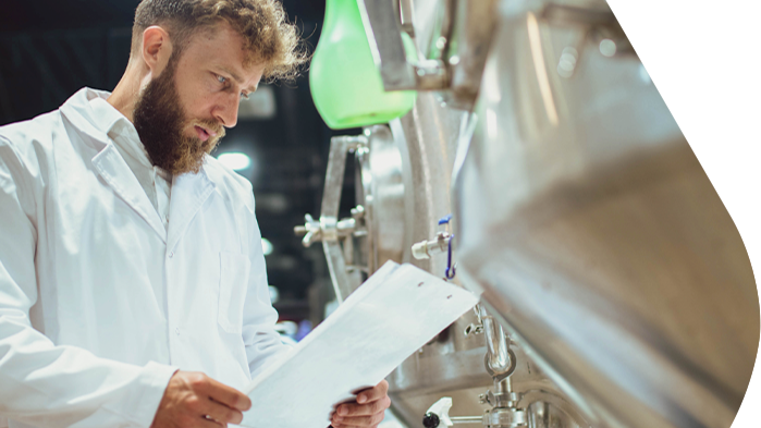 Quality control inspection in a brewery using oil-free compressed air systems to support beer quality and production reliability.