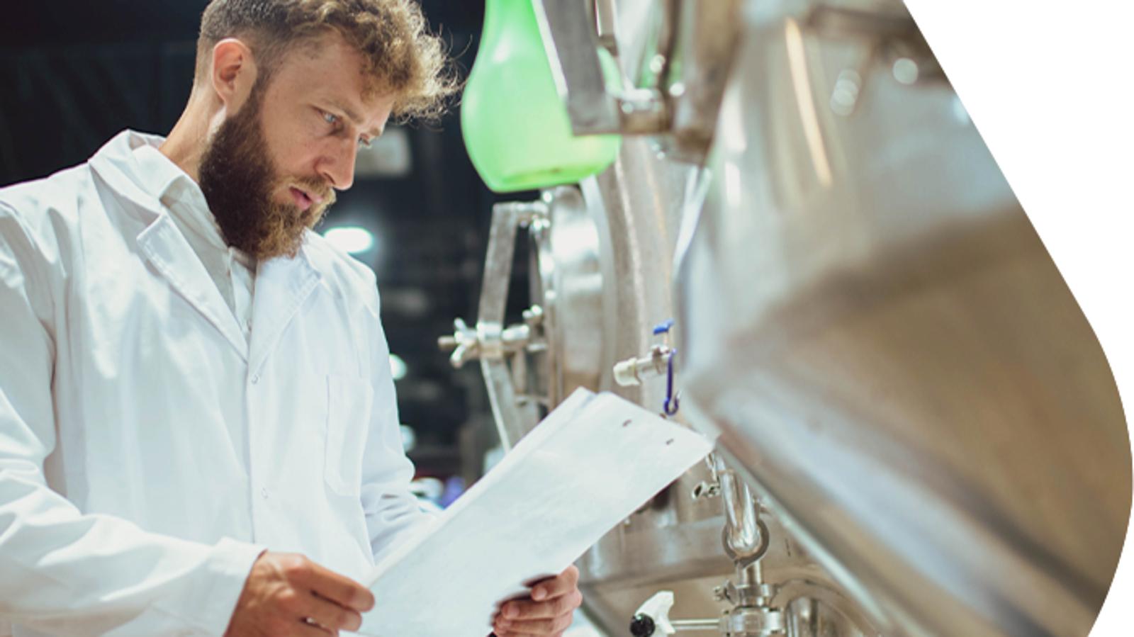 Quality control inspection in a brewery using oil-free compressed air systems to support beer quality and production reliability.