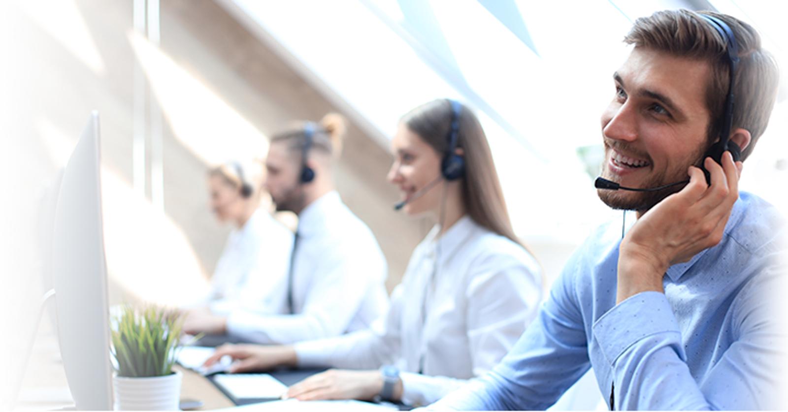 Customer support team wearing headsets.