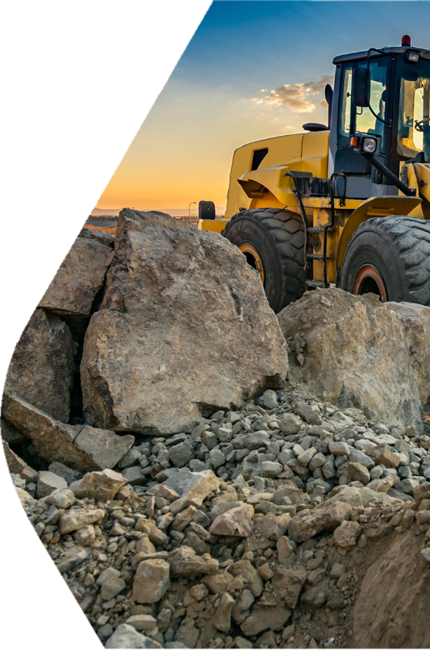 Mining loader moving rock in open-pit site