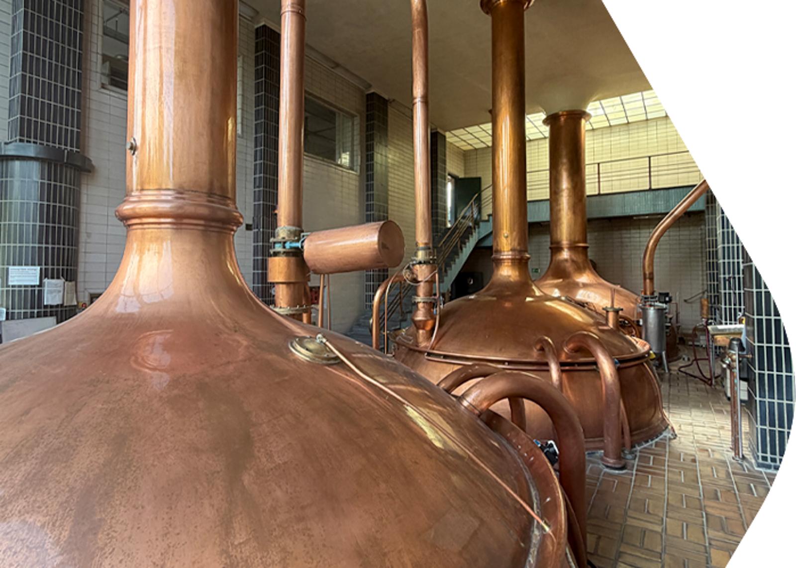 Brewing vessels used in brewery production processes supported by compressed air systems.