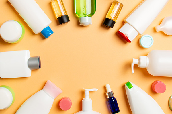 frame-of-plastic-bodycare-bottle-flat-lay