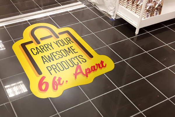 Social distancing decals to control traffic flow