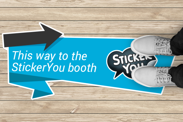Floor decal giving directions to a trade show booth
