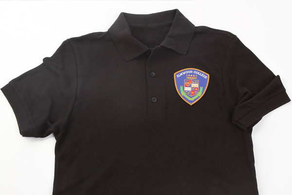 Man holding a die-cut single sticker of a company logo