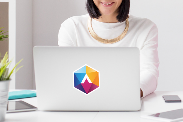 Company logo sticker on the back of a laptop