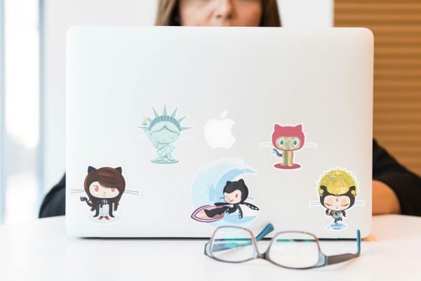 Five stickers, properly arranged on a laptop.
