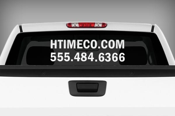 Website address and phone number on the rear windshield of a vehicle