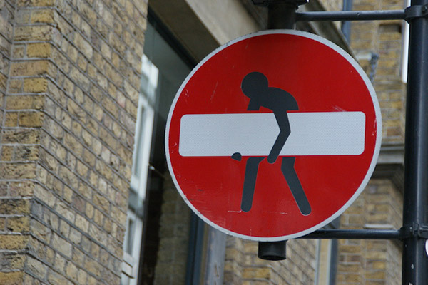 street sign with sticker do not enter