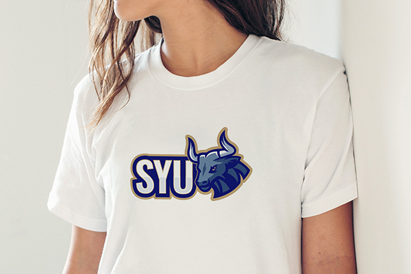 Girl wearing t-shirt with school team logo iron-on