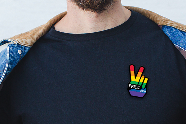 Man holding a die-cut single sticker of a company logo