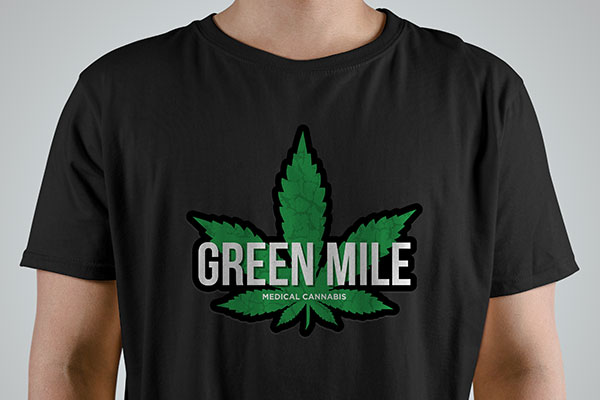 Custom cannabis logo iron-on graphic on a black t-shirt
