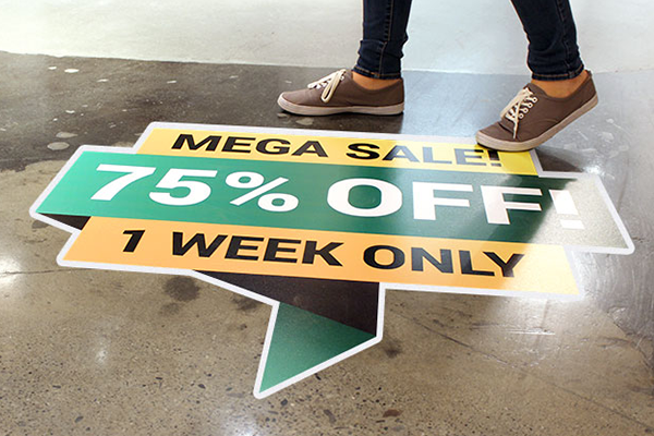 Floor decal advertising a sale