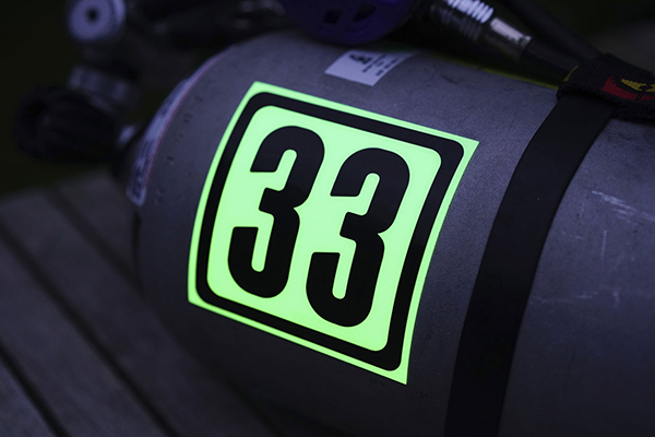 Glow in the dark sticker on safety equipment