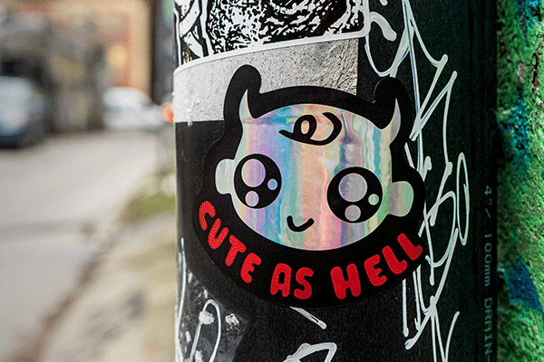 Holographic sticker on a street sign