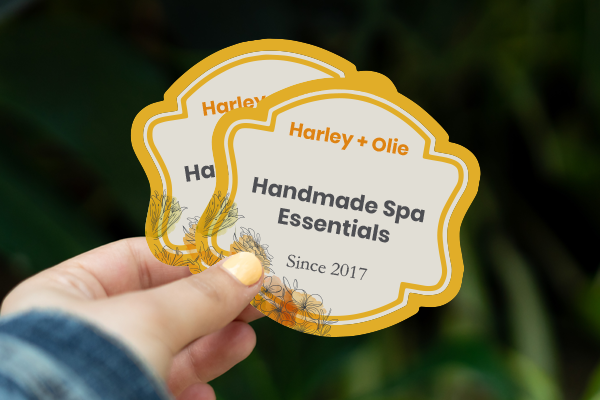 Die-cut singles being held in a hand